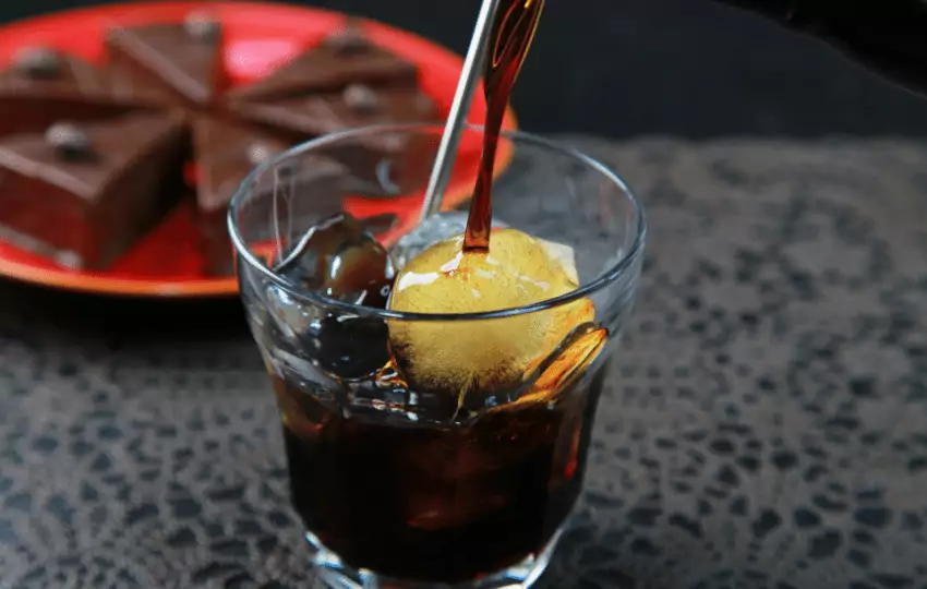 Kahlua has a dark brown color and a sweet, coffee-flavored taste. It is typically served on the rocks or mixed with milk or cream to create various cocktails.