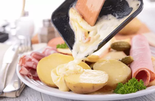 raclette is traditionally melted and then scraped onto potatoes bread or other dishes and also a great alternative for gruyere cheese